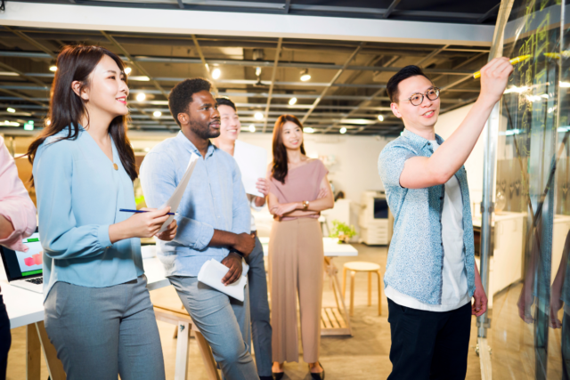 Group of colleagues collaborating in an office workspace